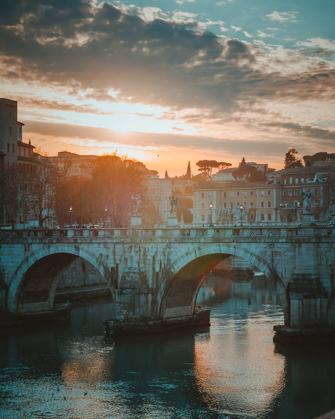 St Angelo bridge with a sunset in the background