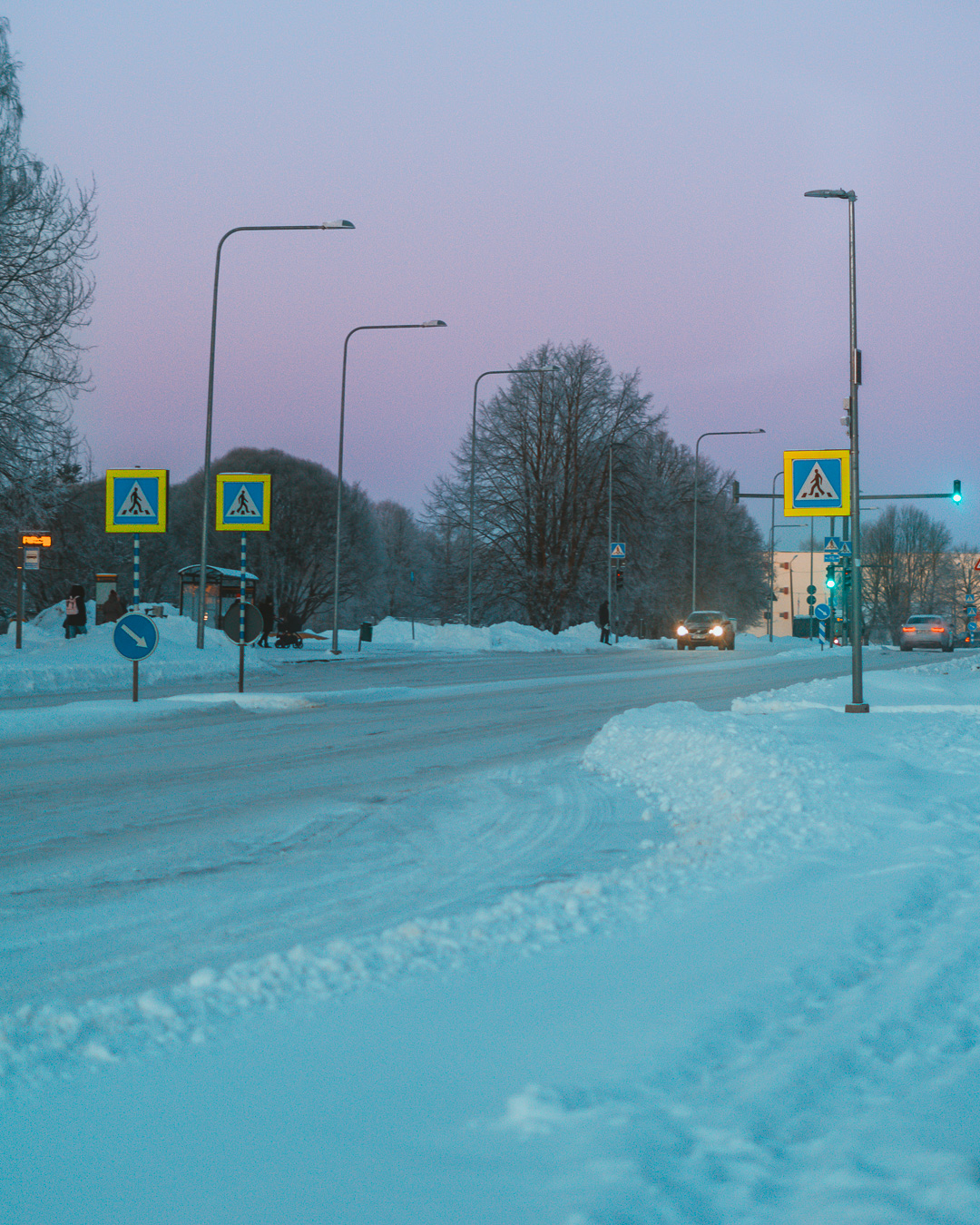 snowy road with pink sunrise